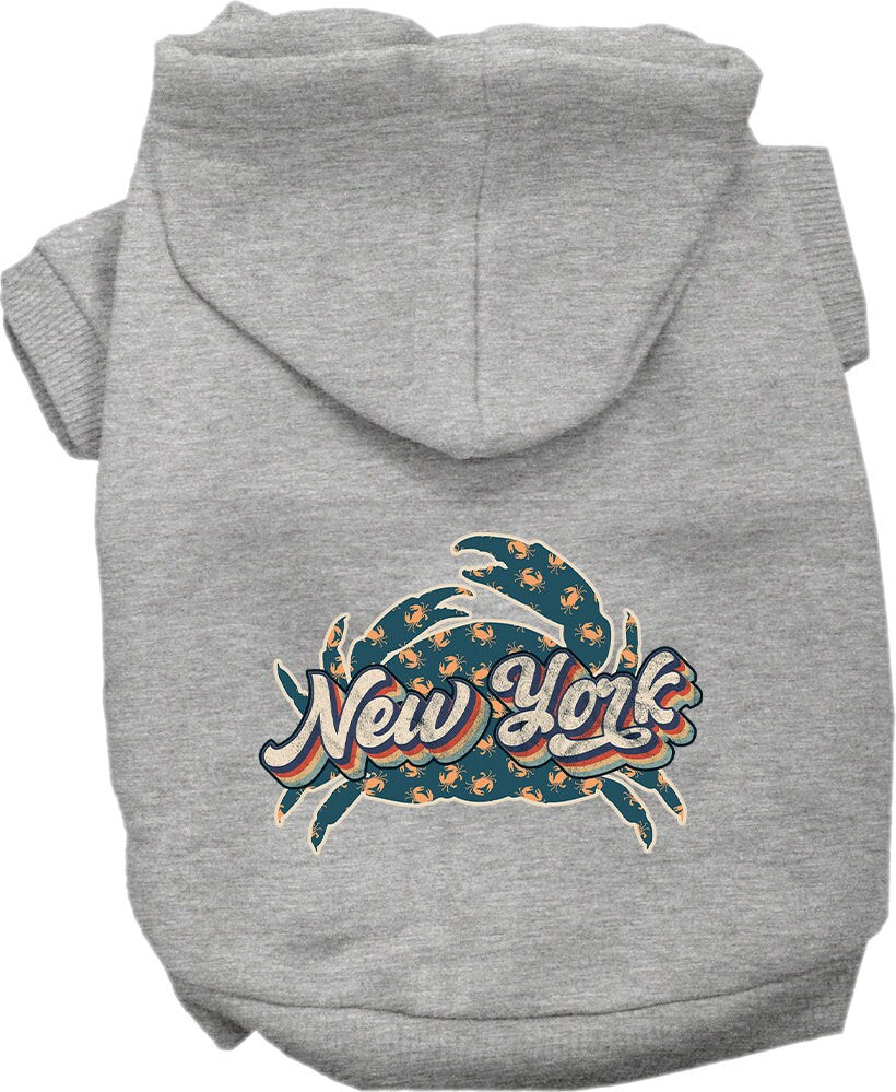 A cozy screen printed hoodie for small to medium pets featuring a fun 'New York Retro Crabs' design, perfect for chilly weather.