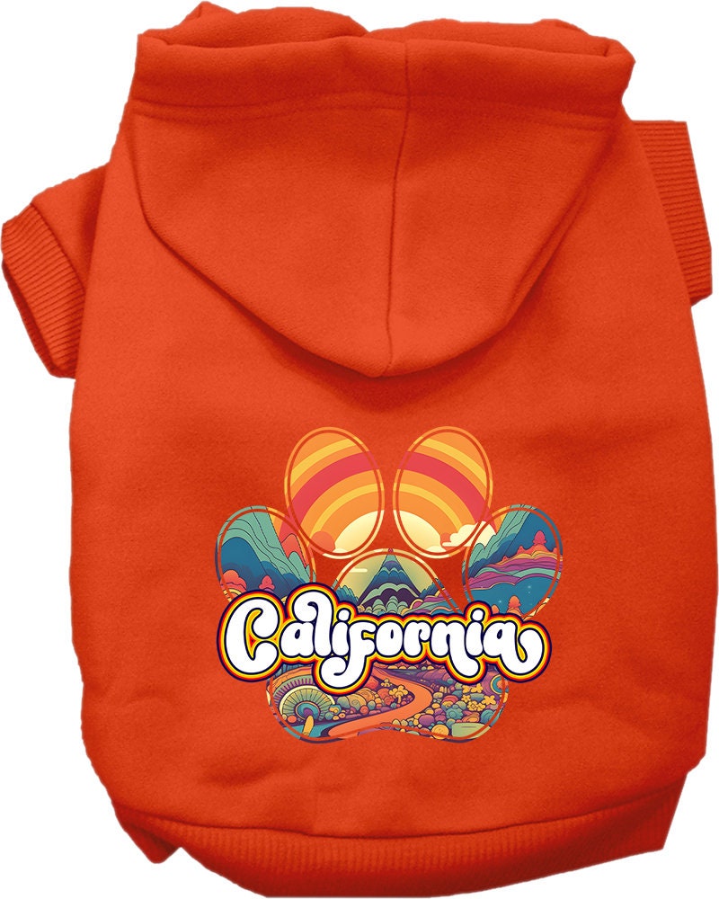 A small to medium pet wearing a California Groovy Summit screen printed hoodie, showcasing its soft fabric and stylish design.