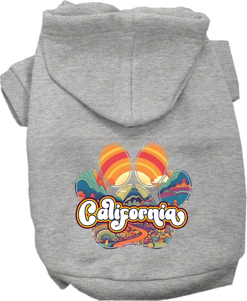A small to medium pet wearing a California Groovy Summit screen printed hoodie, showcasing its soft fabric and stylish design.