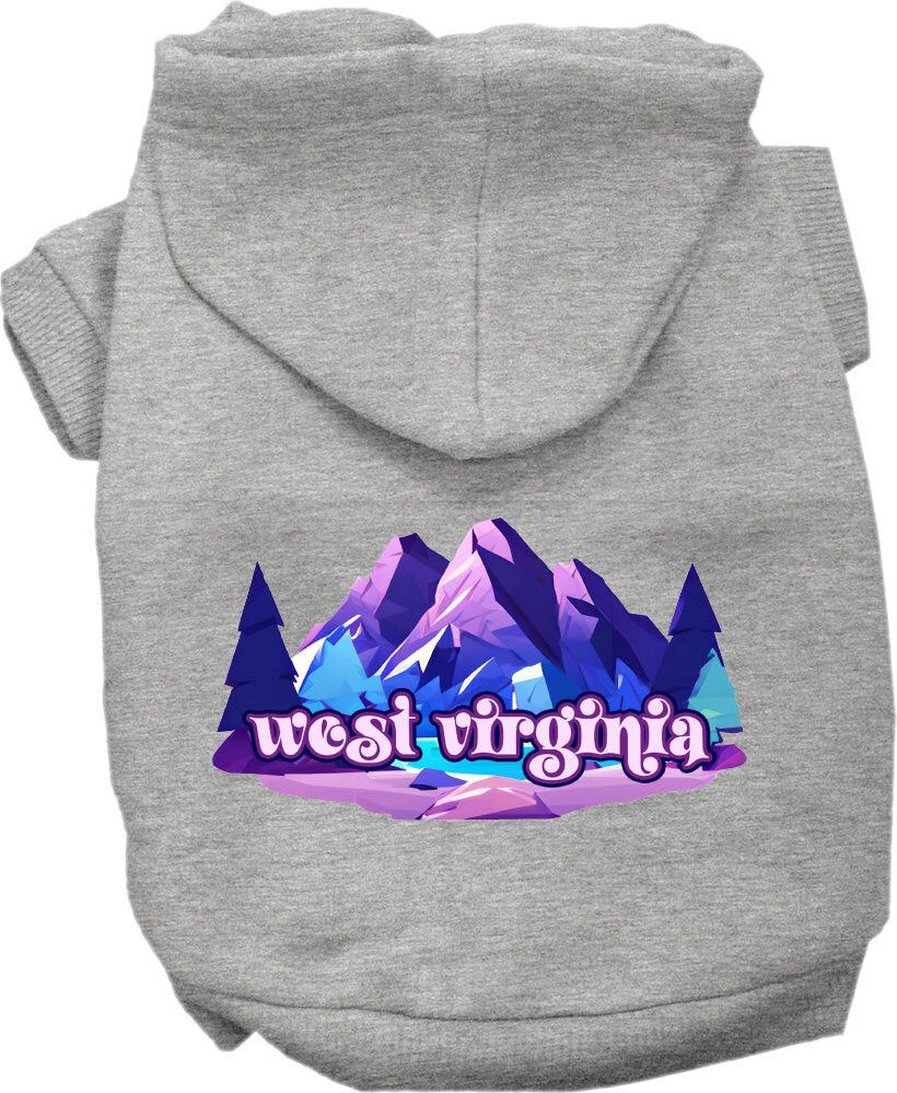 A small to medium pet wearing a cozy screen printed hoodie featuring the 'West Virginia Alpine Pawscape' design, showcasing comfort and style.