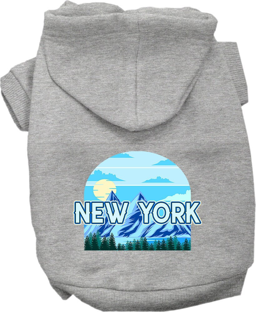 A small to medium pet wearing a stylish New York Trailblazer hoodie, showcasing its soft fabric and convenient leash access hole.