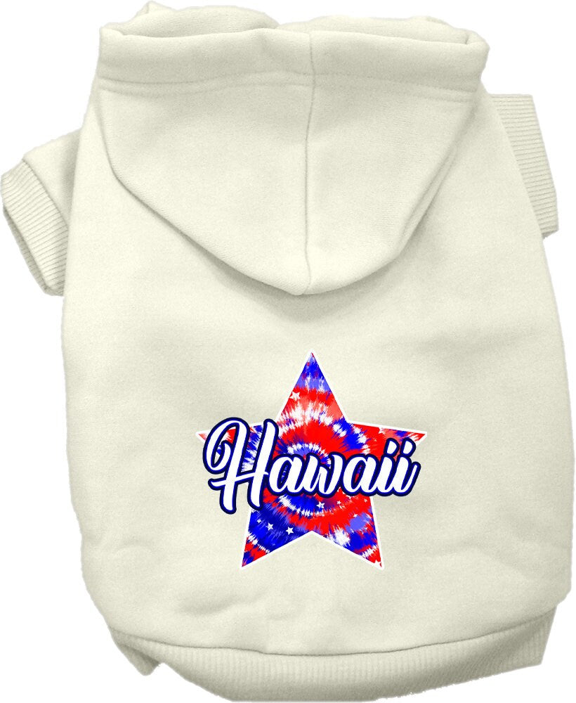 A small to medium pet wearing a colorful Hawaii Patriotic Tie Dye hoodie, showcasing its soft fabric and convenient leash access hole.