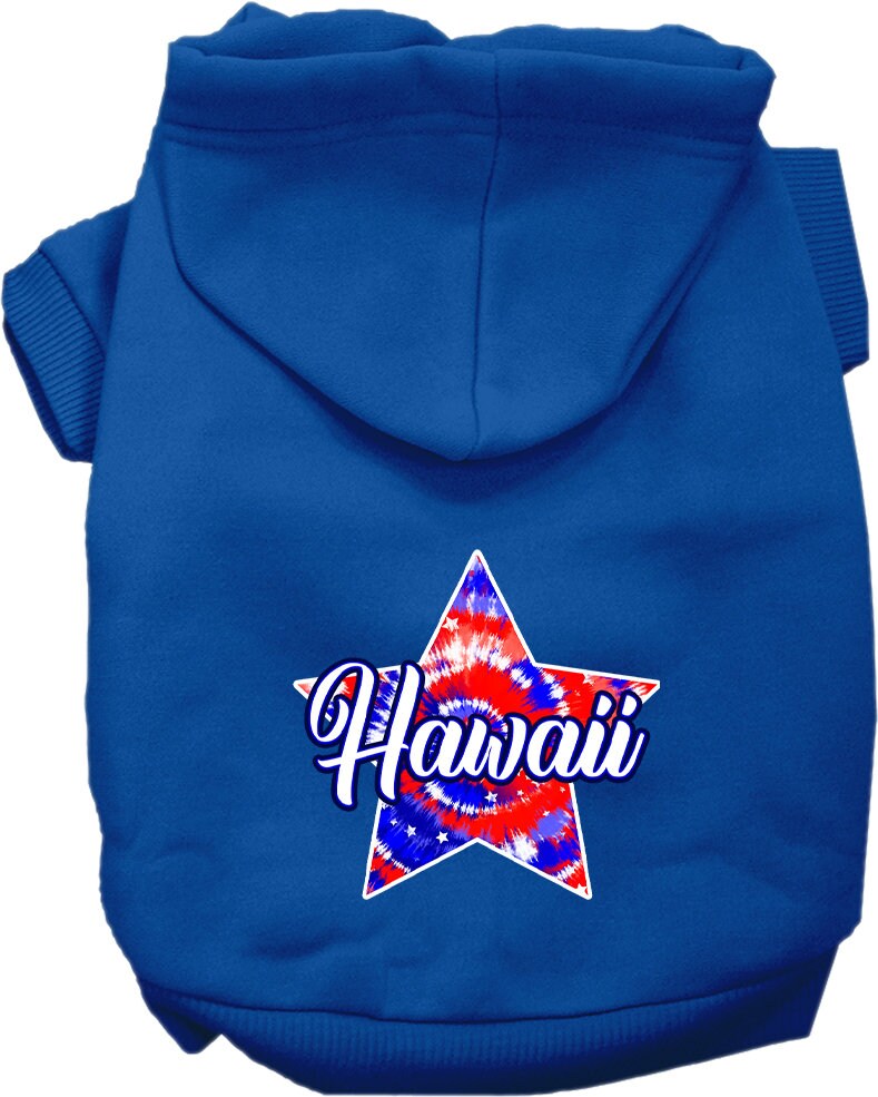 A small to medium pet wearing a colorful Hawaii Patriotic Tie Dye hoodie, showcasing its soft fabric and convenient leash access hole.