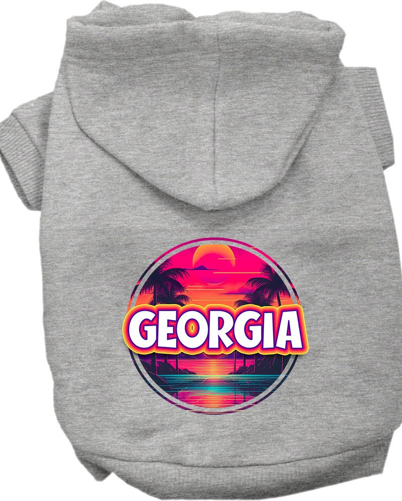 A small to medium pet wearing a vibrant Georgia Neon Beach Sunset hoodie, showcasing its soft fabric and stylish design.