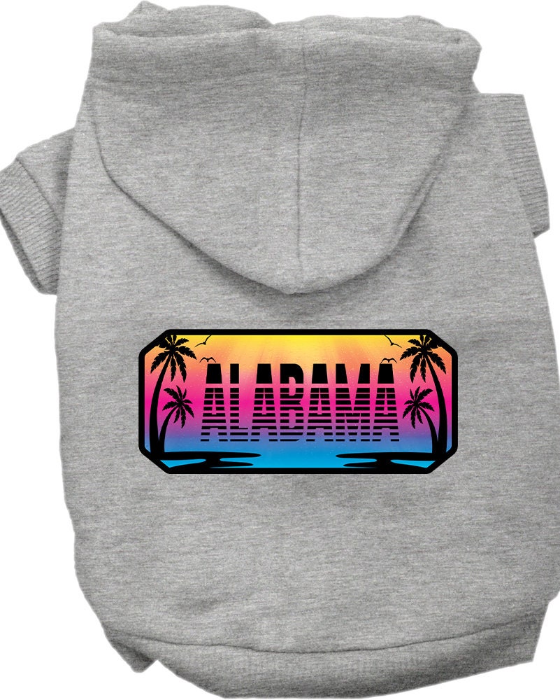 A small to medium pet wearing a cozy screen printed hoodie with Alabama Beach Shades design, showcasing its soft fabric and convenient leash access hole.