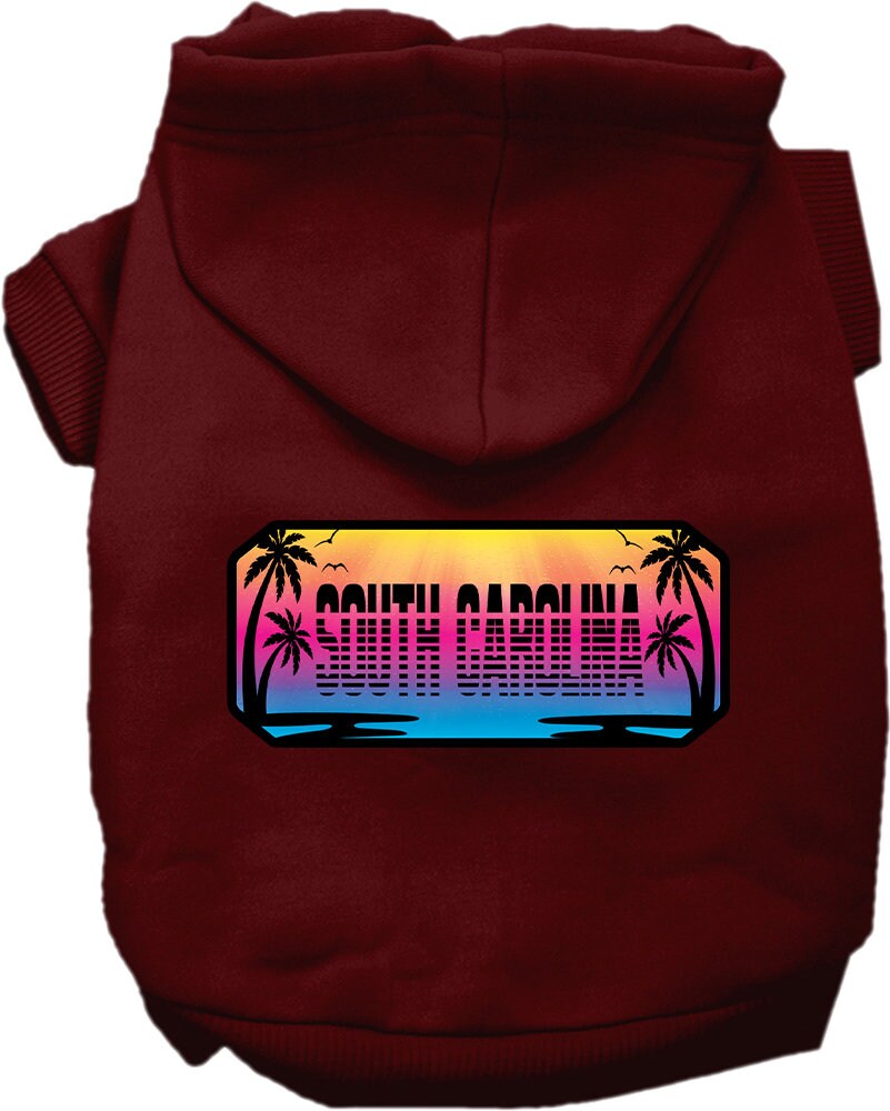 A small to medium pet wearing a stylish screen printed hoodie with a South Carolina Beach Shades design, showcasing vibrant colors and a comfortable fit.