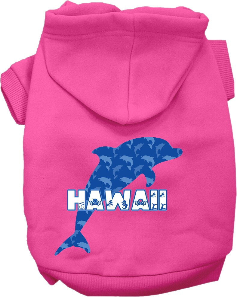 A small to medium pet wearing a Hawaii Blue Dolphins screen printed hoodie, showcasing its vibrant design and comfortable fit.