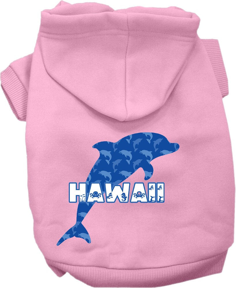 A small to medium pet wearing a Hawaii Blue Dolphins screen printed hoodie, showcasing its vibrant design and comfortable fit.