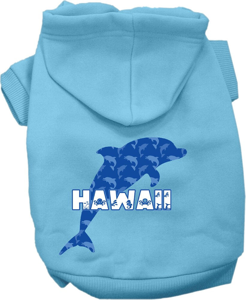 A small to medium pet wearing a Hawaii Blue Dolphins screen printed hoodie, showcasing its vibrant design and comfortable fit.