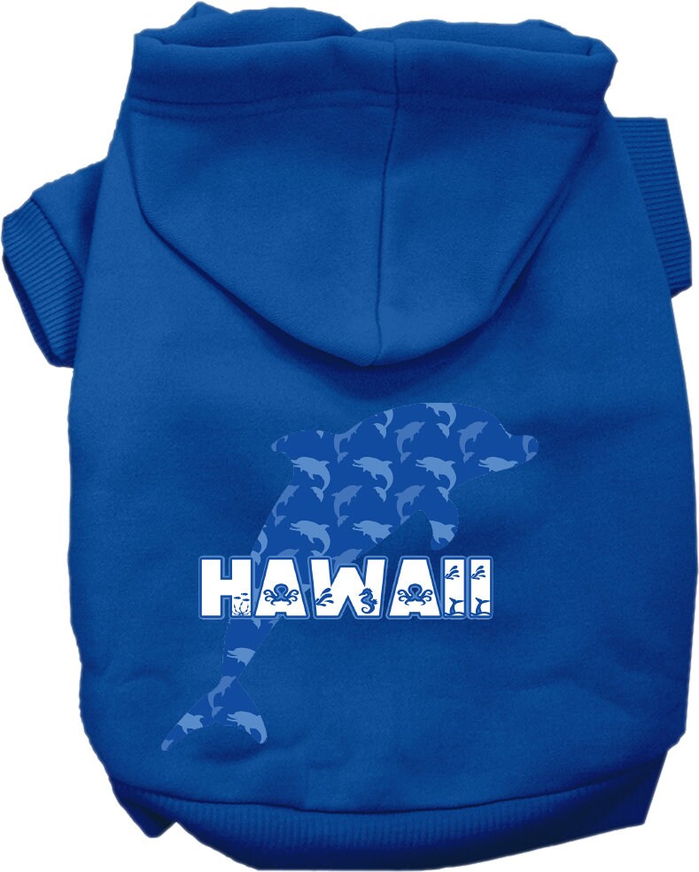 A small to medium pet wearing a Hawaii Blue Dolphins screen printed hoodie, showcasing its vibrant design and comfortable fit.