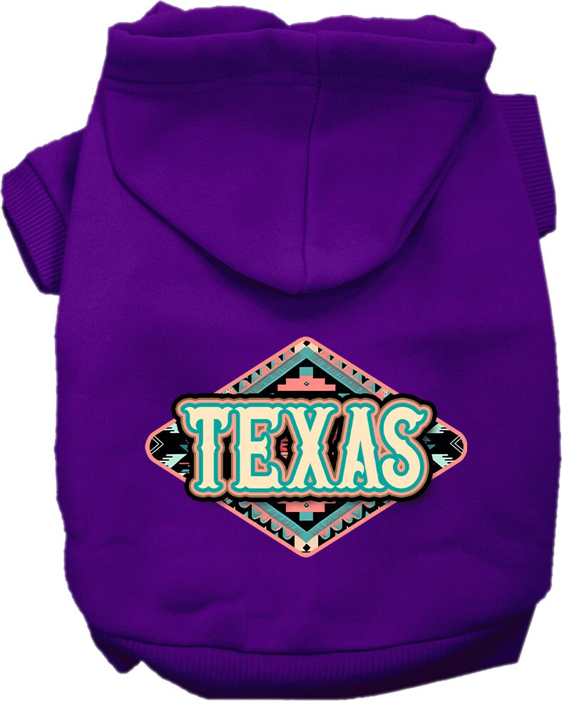A small to medium pet wearing a stylish Texas Peach Aztec screen printed hoodie, showcasing its soft fabric and convenient leash access hole.