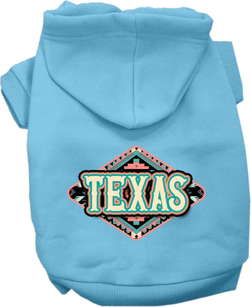 A small to medium pet wearing a stylish Texas Peach Aztec screen printed hoodie, showcasing its soft fabric and convenient leash access hole.
