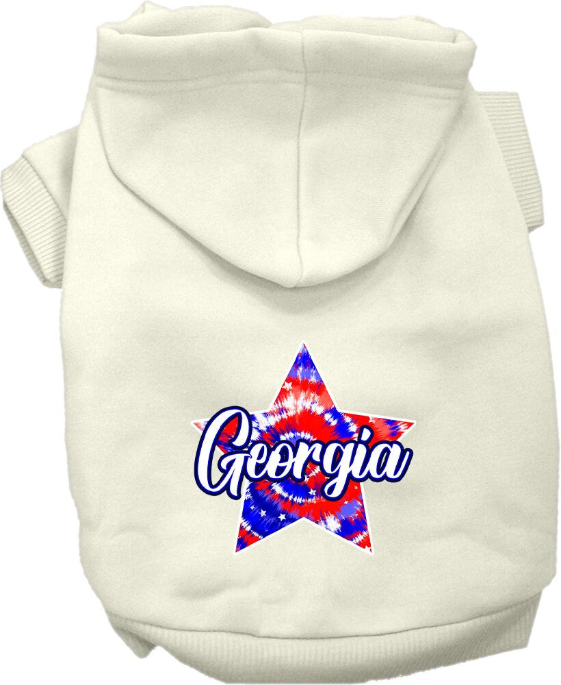 A small to medium pet wearing a Georgia Patriotic Tie Dye hoodie, showcasing vibrant colors and a cozy fit.