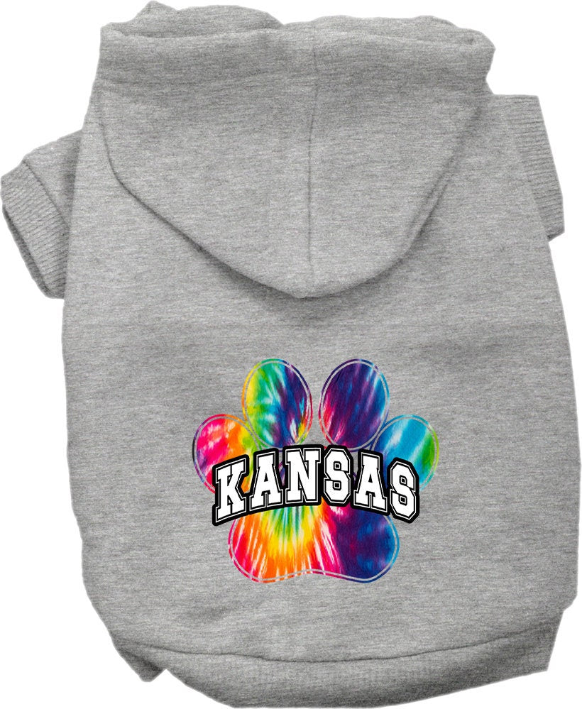 A small to medium pet wearing a Kansas Bright Tie Dye hoodie, showcasing vibrant colors and a comfortable fit.