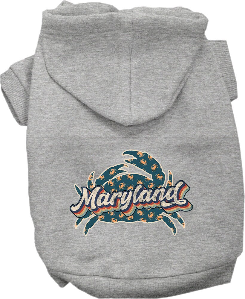 A small to medium pet wearing a Maryland Retro Crabs screen printed hoodie, showcasing its soft fabric and stylish design.
