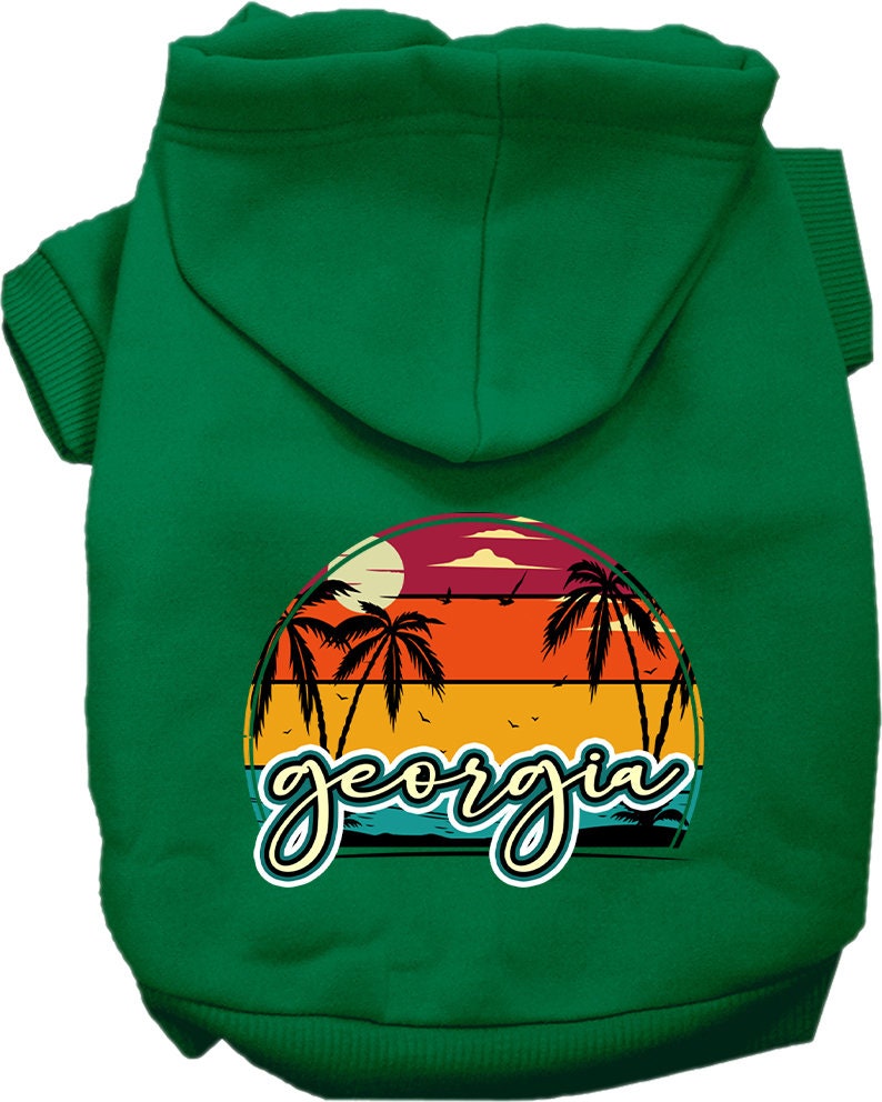 A small to medium pet wearing a stylish Georgia Retro Beach Sunset hoodie, showcasing its vibrant colors and comfortable fit.