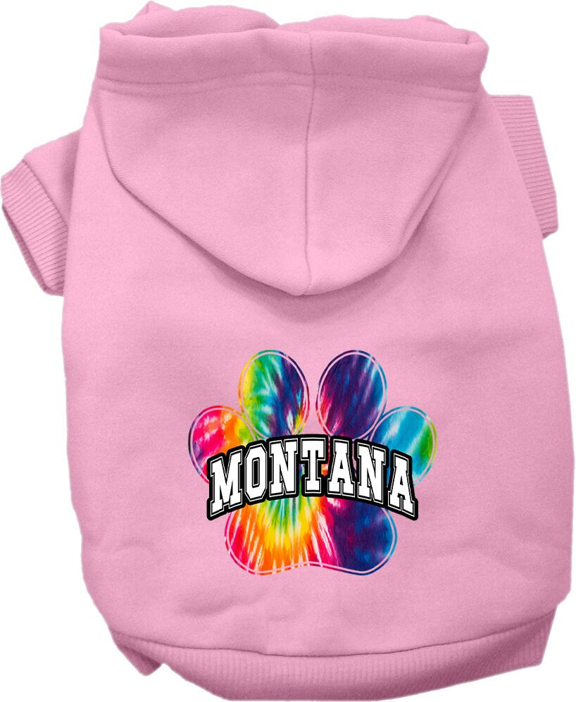 A small to medium pet wearing a colorful Montana Bright Tie Dye hoodie, showcasing its soft fabric and convenient leash access hole.