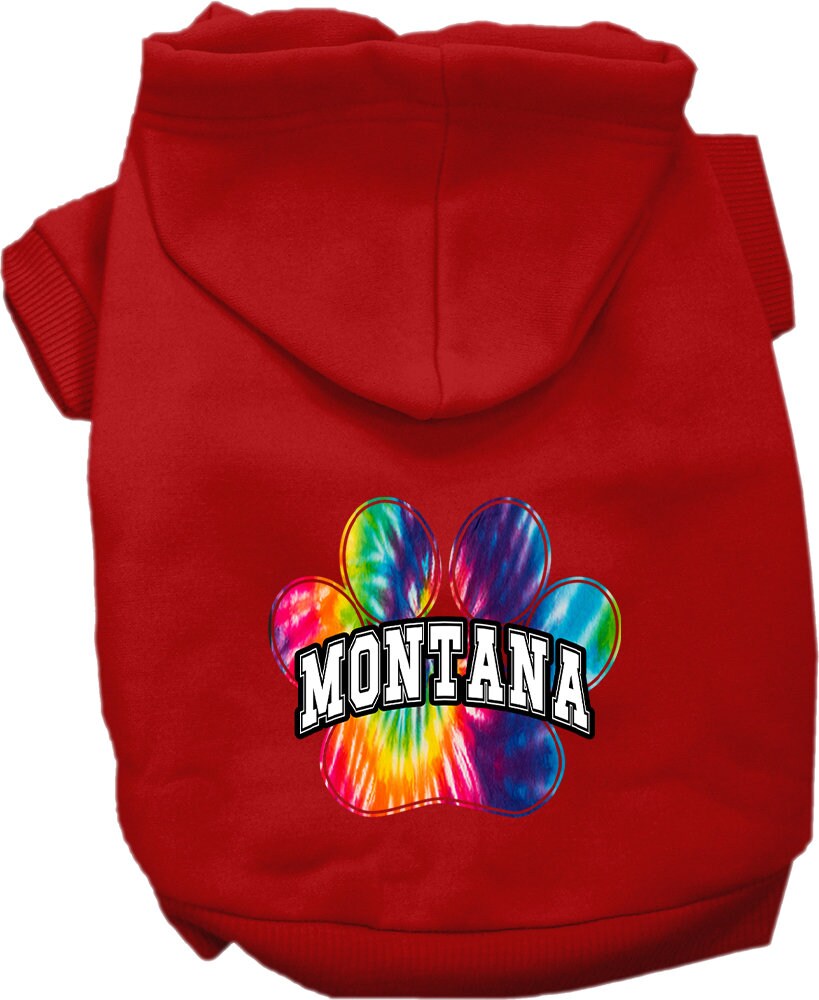 A small to medium pet wearing a colorful Montana Bright Tie Dye hoodie, showcasing its soft fabric and convenient leash access hole.