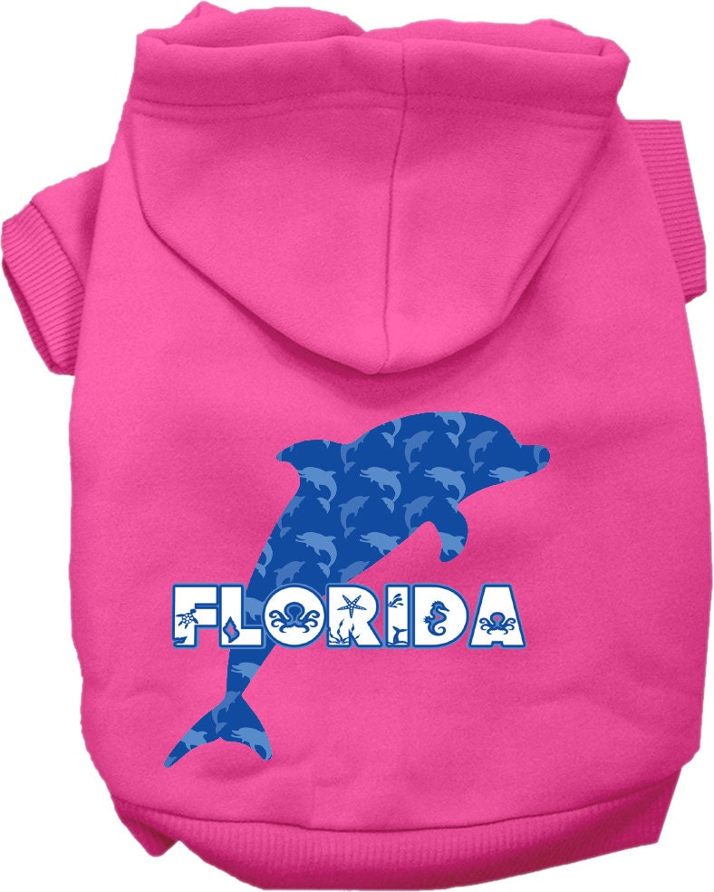 A small to medium pet wearing a Florida Blue Dolphins screen printed hoodie, showcasing its soft fabric and stylish design.