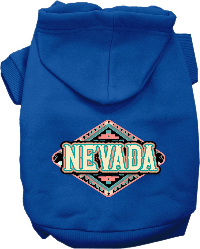 A small to medium pet wearing a stylish screen printed hoodie with a 'Nevada Peach Aztec' design, showcasing its soft fabric and convenient leash access hole.