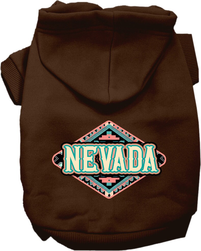 A small to medium pet wearing a stylish screen printed hoodie with a 'Nevada Peach Aztec' design, showcasing its soft fabric and convenient leash access hole.