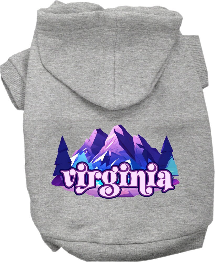 A small to medium pet wearing a cozy screen printed hoodie with a Virginia Alpine Pawscape design, showcasing its soft fabric and convenient leash access.