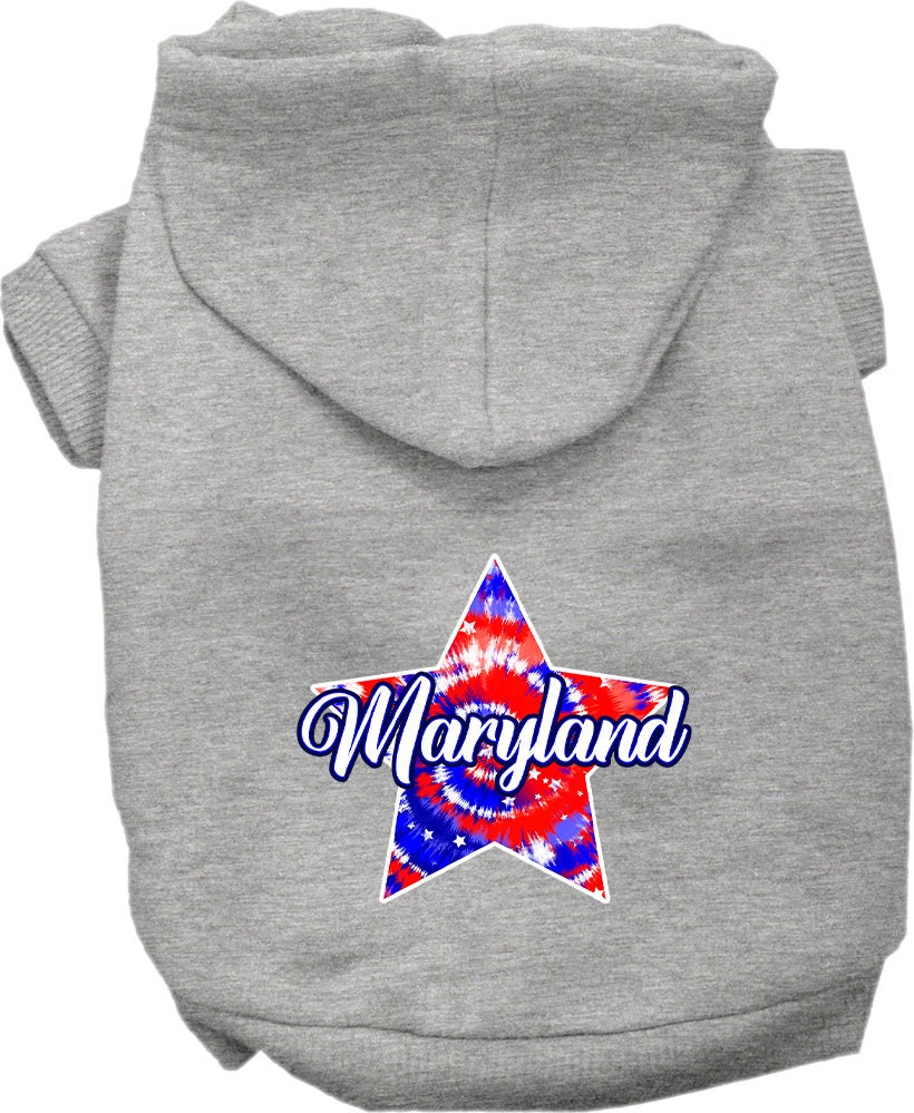 A small to medium pet wearing a Maryland Patriotic Tie Dye hoodie, showcasing vibrant colors and a comfortable fit.
