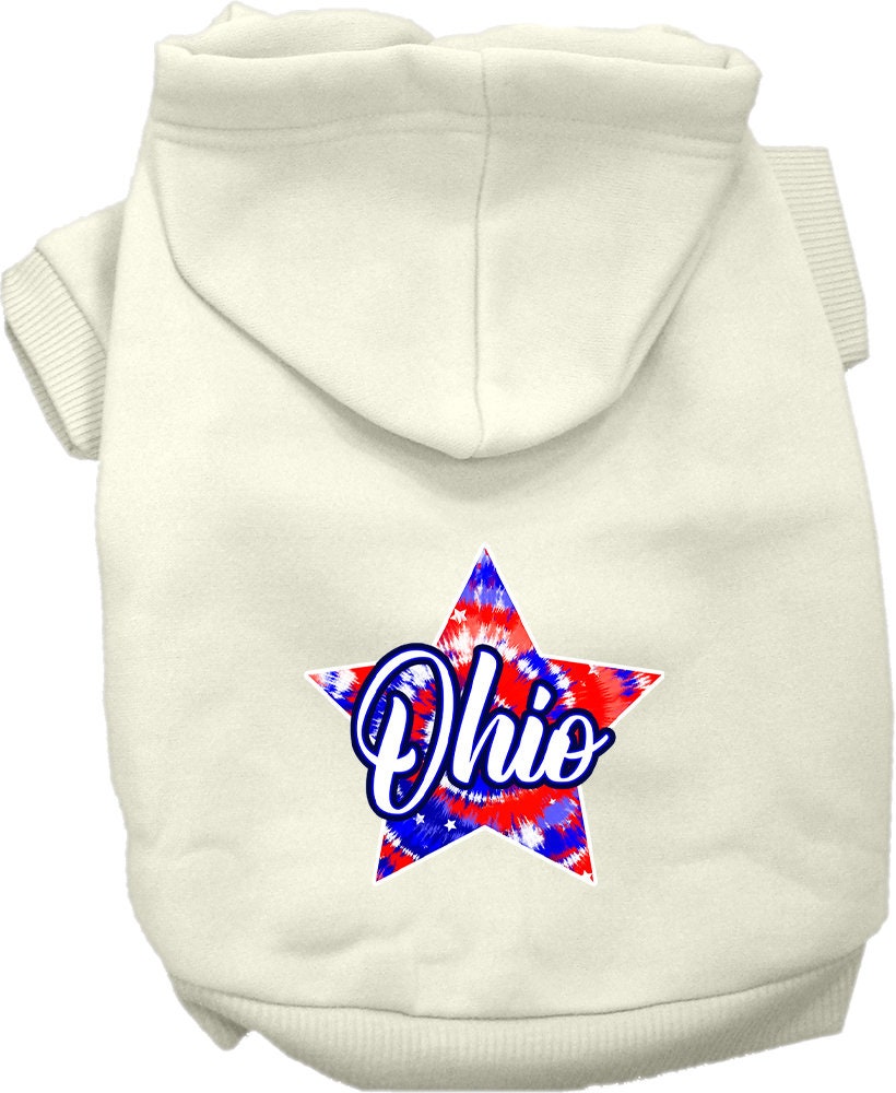 A small to medium pet wearing a vibrant Ohio Patriotic Tie Dye hoodie, showcasing its soft fabric and convenient leash access hole.