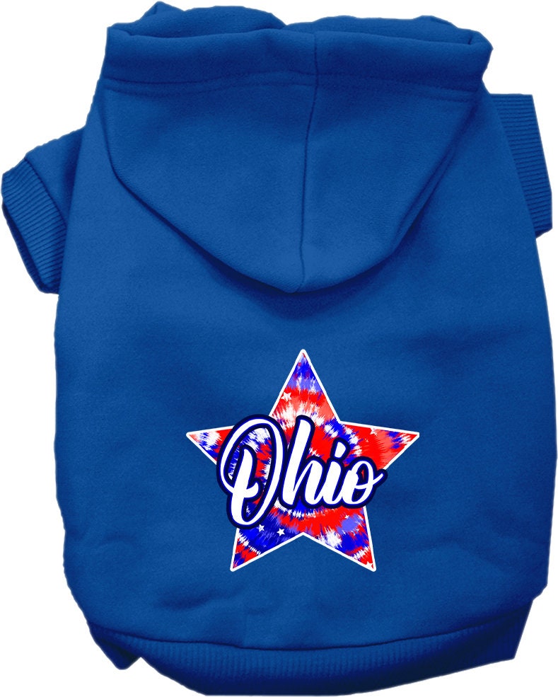 A small to medium pet wearing a vibrant Ohio Patriotic Tie Dye hoodie, showcasing its soft fabric and convenient leash access hole.