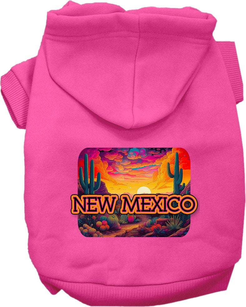 A small to medium pet wearing a vibrant New Mexico Neon Desert printed hoodie, showcasing its soft fabric and convenient leash access hole.