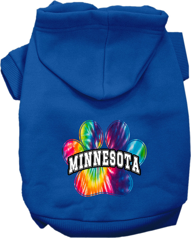 A small to medium pet wearing a colorful Minnesota Bright Tie Dye hoodie, showcasing its soft fabric and convenient leash access hole.