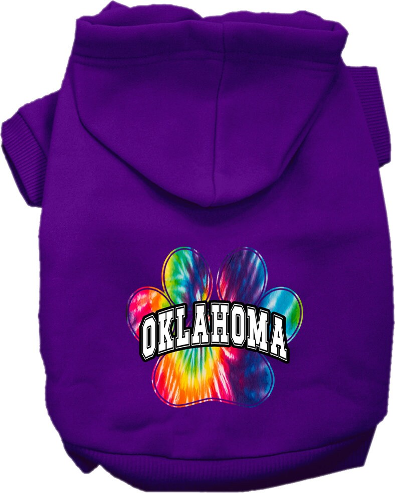 A small to medium pet wearing a vibrant Oklahoma Bright Tie Dye hoodie, showcasing its soft fabric and convenient leash access hole.