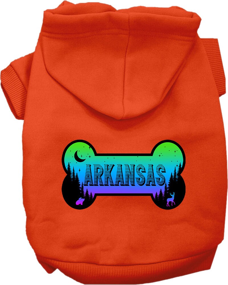 A small to medium pet wearing a stylish screen printed hoodie with Arkansas Mountain Shades design, showcasing its soft fabric and convenient leash access hole.