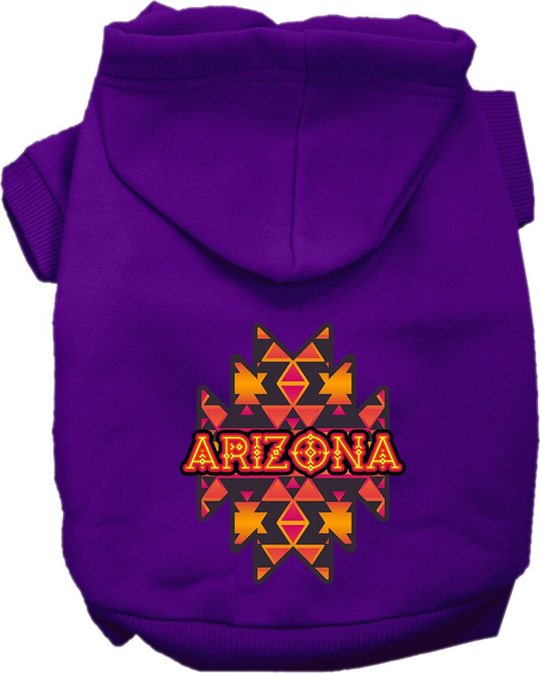 A small to medium pet wearing a cozy Arizona Navajo Tribal screen printed hoodie, showcasing its unique design and comfortable fit.