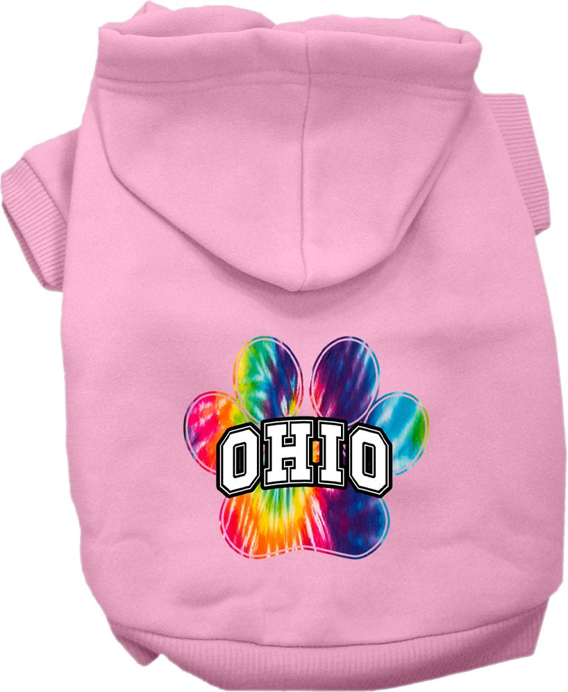 A small to medium pet wearing a vibrant Ohio Bright Tie Dye hoodie, showcasing its soft fabric and convenient leash access hole.