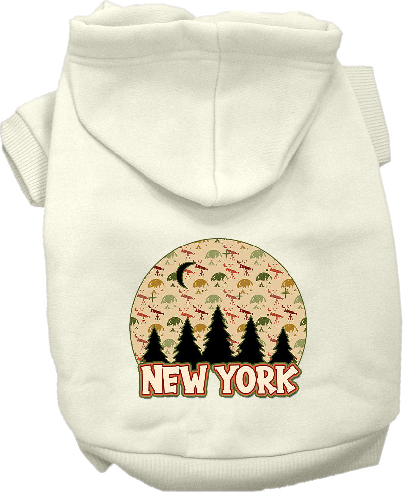 A small to medium pet wearing a stylish screen printed hoodie with a 'New York Under The Stars' design, showcasing its soft fabric and convenient leash access hole.