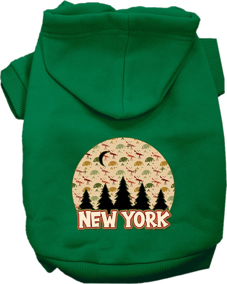 A small to medium pet wearing a stylish screen printed hoodie with a 'New York Under The Stars' design, showcasing its soft fabric and convenient leash access hole.