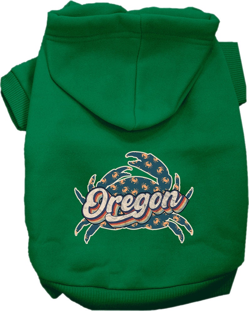 A small to medium pet wearing a cozy Oregon Retro Crabs screen printed hoodie, showcasing its vibrant design and comfortable fit.