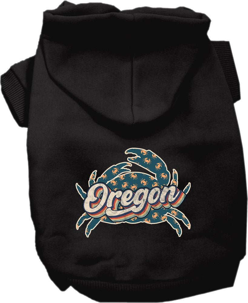A small to medium pet wearing a cozy Oregon Retro Crabs screen printed hoodie, showcasing its vibrant design and comfortable fit.