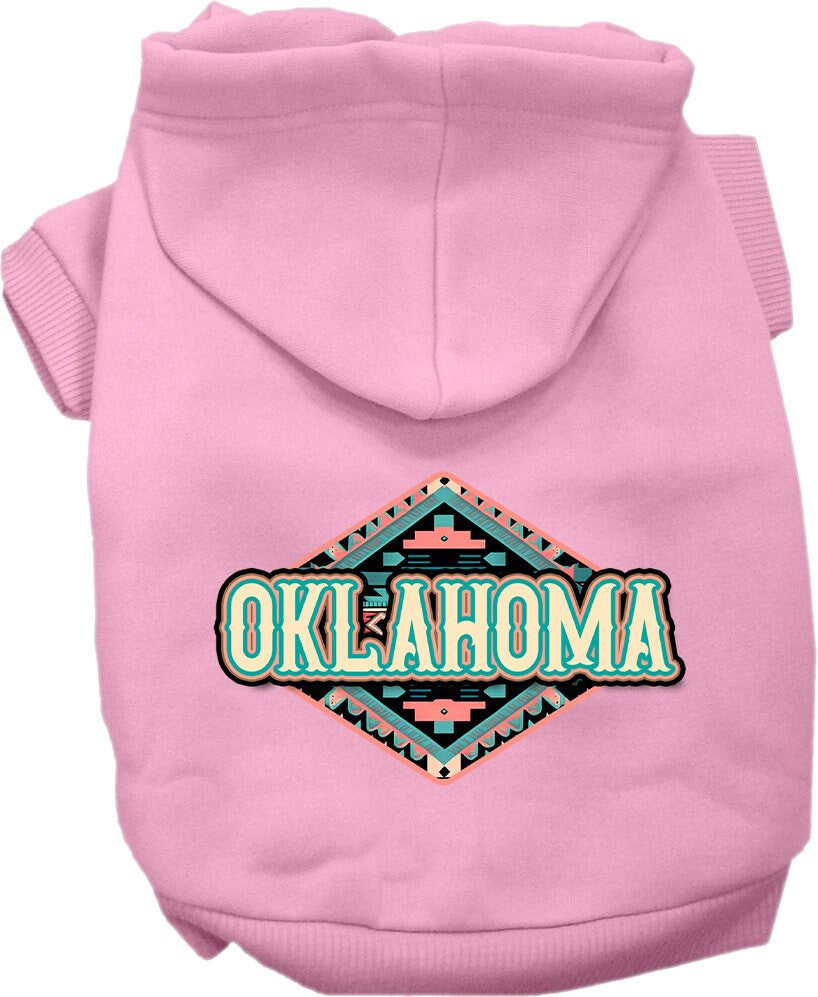 A small to medium pet wearing a cozy Oklahoma Peach Aztec hoodie, showcasing its vibrant colors and stylish design.