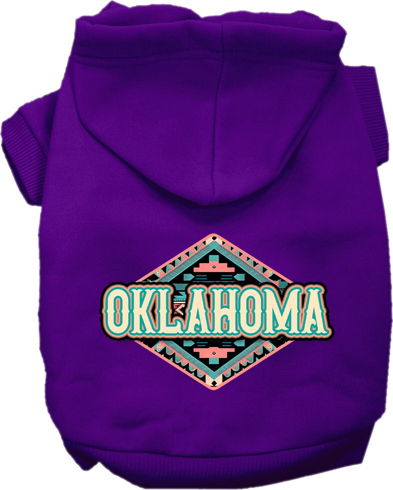 A small to medium pet wearing a cozy Oklahoma Peach Aztec hoodie, showcasing its vibrant colors and stylish design.