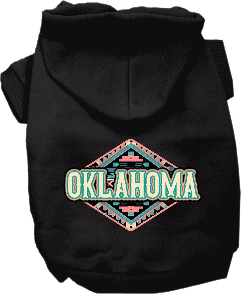 A small to medium pet wearing a cozy Oklahoma Peach Aztec hoodie, showcasing its vibrant colors and stylish design.