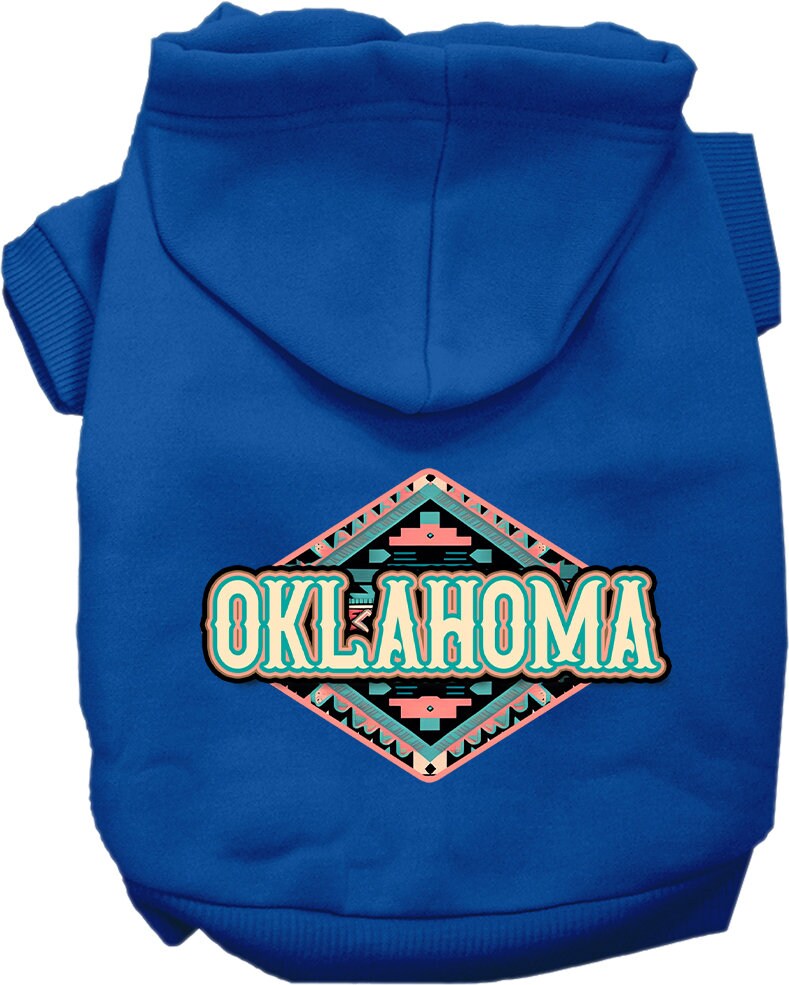 A small to medium pet wearing a cozy Oklahoma Peach Aztec hoodie, showcasing its vibrant colors and stylish design.