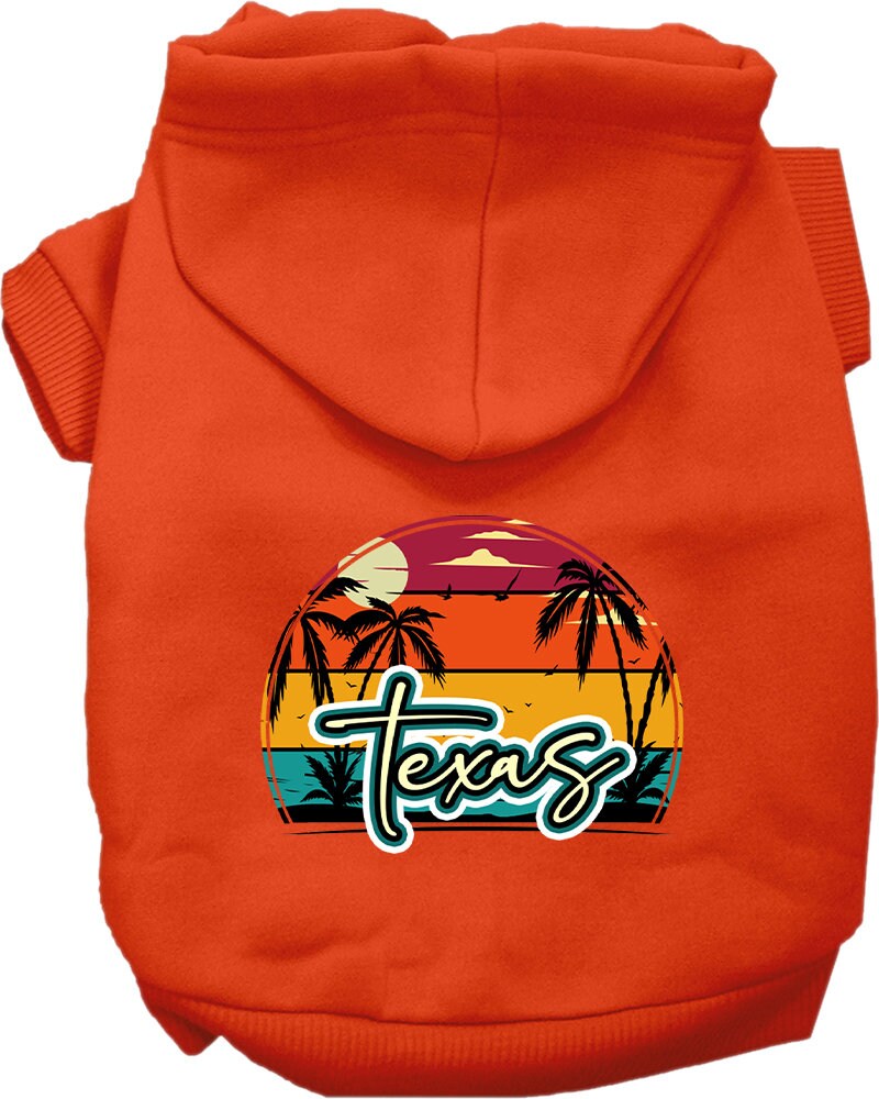A small to medium pet wearing a stylish Texas Retro Beach Sunset hoodie, showcasing vibrant colors and a cozy fit.
