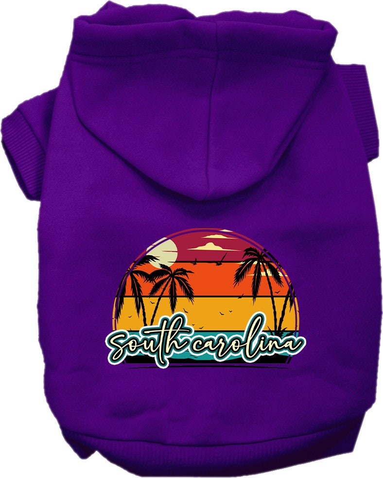 A small to medium pet wearing a soft, stylish hoodie featuring a South Carolina Retro Beach Sunset design, perfect for walks and outdoor activities.