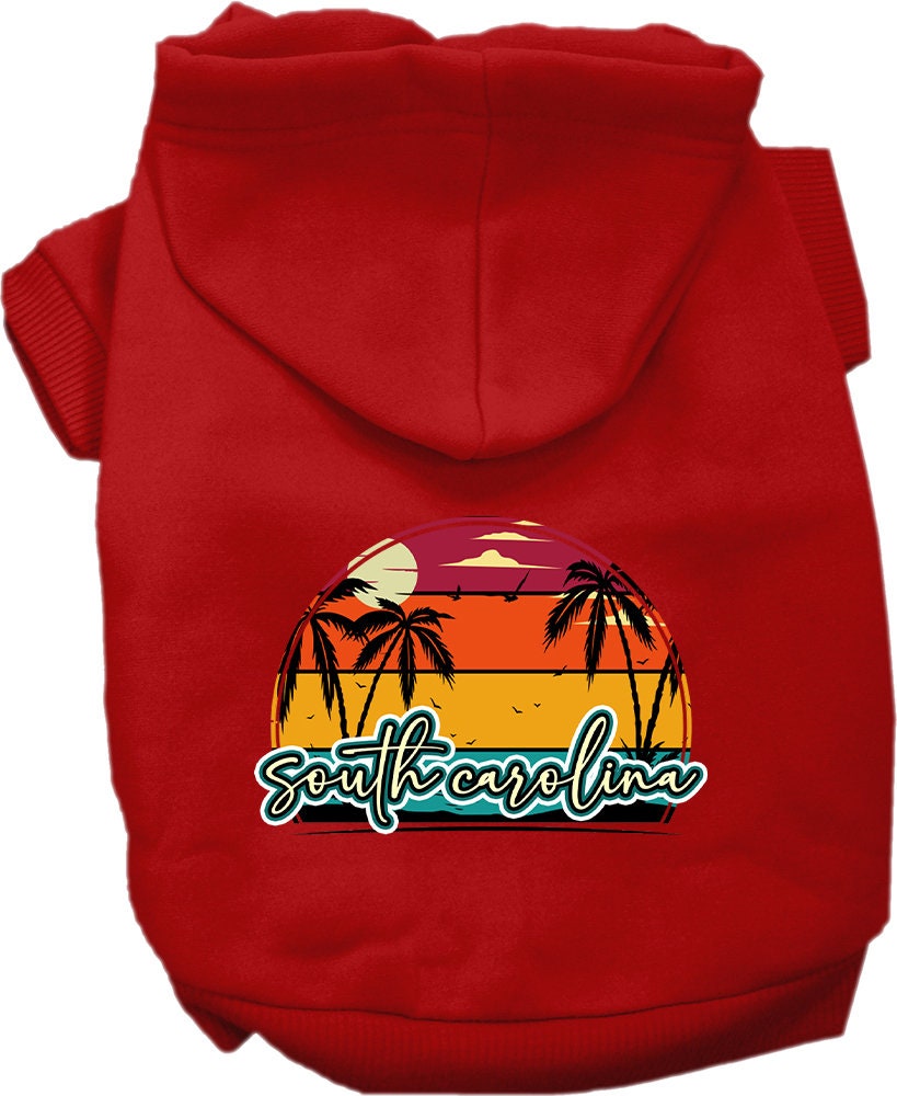 A small to medium pet wearing a soft, stylish hoodie featuring a South Carolina Retro Beach Sunset design, perfect for walks and outdoor activities.