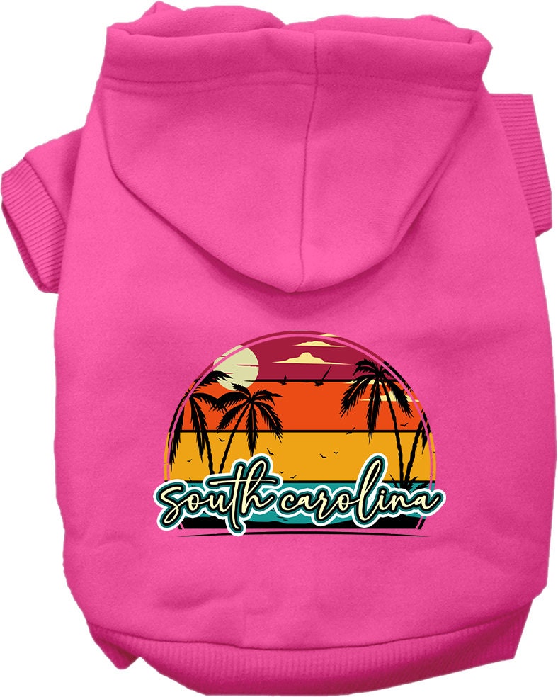 A small to medium pet wearing a soft, stylish hoodie featuring a South Carolina Retro Beach Sunset design, perfect for walks and outdoor activities.