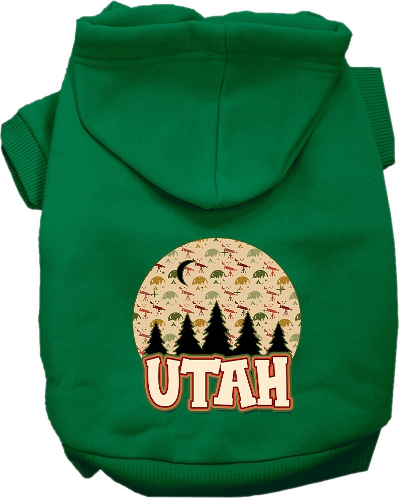 A small to medium pet wearing a cozy screen printed hoodie with a 'Utah Under The Stars' design, showcasing its soft fabric and convenient leash access.