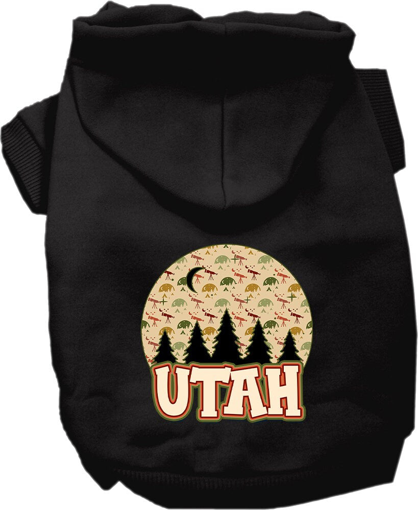 A small to medium pet wearing a cozy screen printed hoodie with a 'Utah Under The Stars' design, showcasing its soft fabric and convenient leash access.
