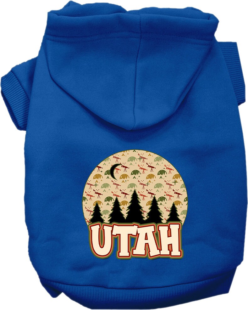 A small to medium pet wearing a cozy screen printed hoodie with a 'Utah Under The Stars' design, showcasing its soft fabric and convenient leash access.
